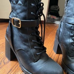 Black heeled combat boots